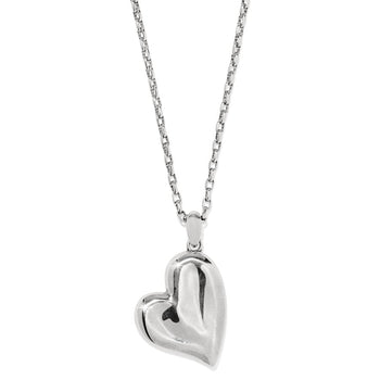 The Cascade Heart Reversible Gold and Silver Necklace with the silver side showing the heart-shaped pendant hanging on a twisted chain. The background is plain and white.