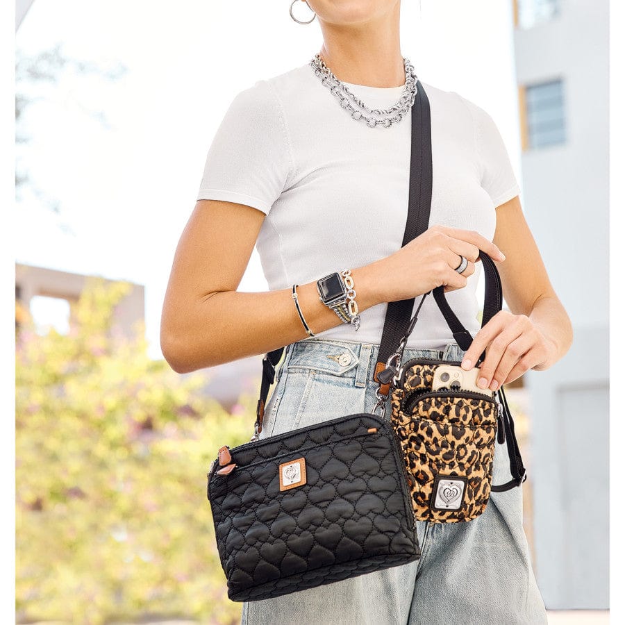 Kora Mini Utility Bag in leopard print worn by a model, demonstrating the size and stylish look