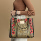 Woman wearing Leopard Dynasty Canvas Carry All tote as a crossbody bag