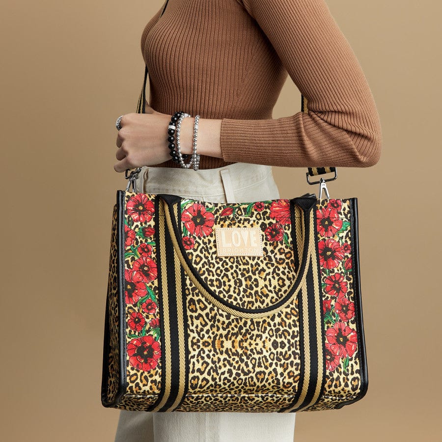 Woman wearing Leopard Dynasty Canvas Carry All tote as a crossbody bag