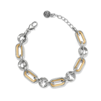 Medici Two Tone Link Bracelet a silver and gold-tone link bracelet rests against a white background. There is a decorative toggle clasp on one end.