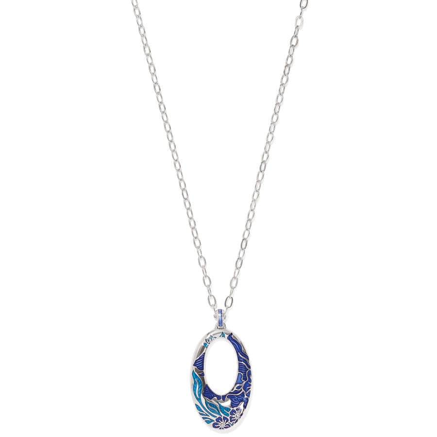 A silver chain Terra Blue Hoop Necklace features an elliptical pendant adorned with intricate blue floral and wave patterns. The pendant's center is hollow, enhancing its ornate design. Set against a plain white background.