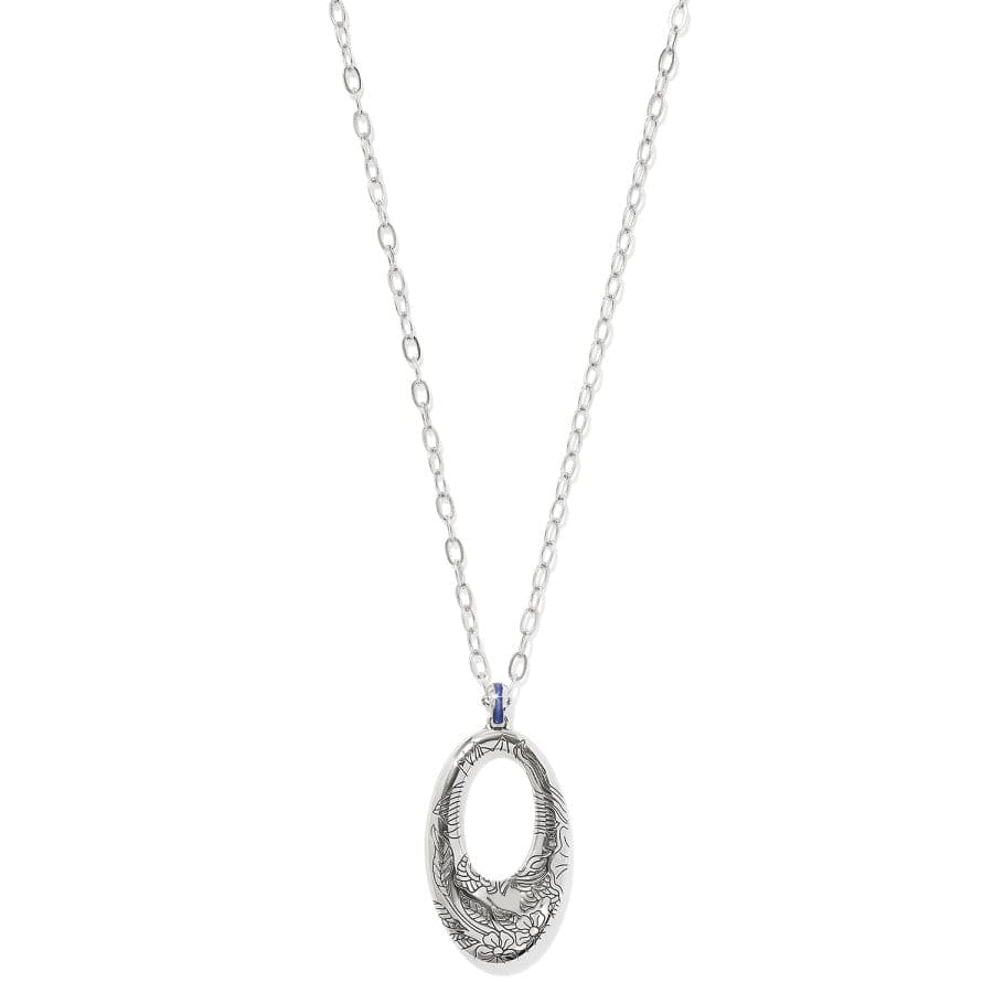 Back view of a Terra Blue Hoop silver necklace with an intricate, oval-shaped pendant featuring floral designs hangs from a simple chain against a white background.