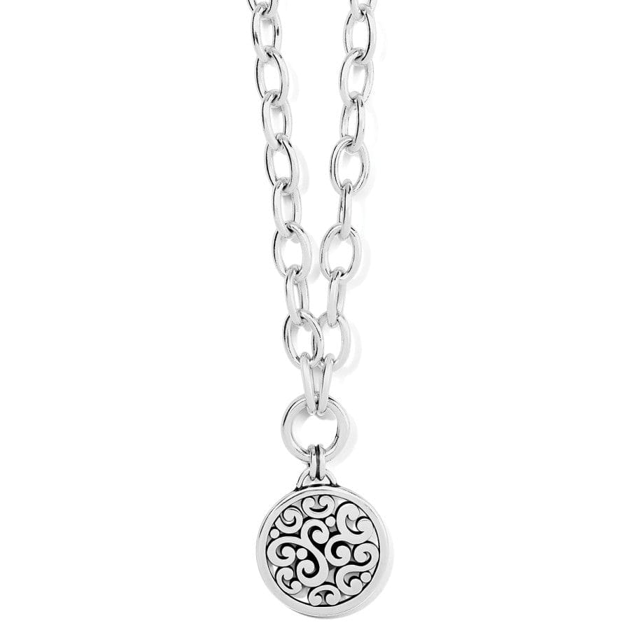 Close-up of the Contempo Medallion Charm Necklace, highlighting the intricate patterns and silver detailing on the medallion