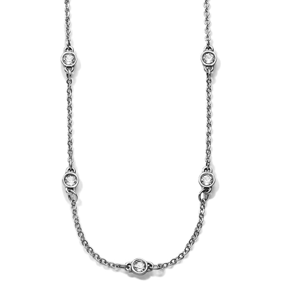 The Illumina Petite Collar Necklace a silver chain necklace with evenly spaced, encased diamond-like stones, displayed against a white background.