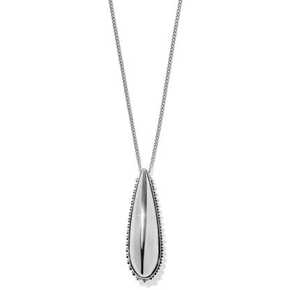 Pretty Tough Droplet Necklace a silver teardrop-shaped pendant with a smooth reflective surface hangs on a matching chain up close against a white background.